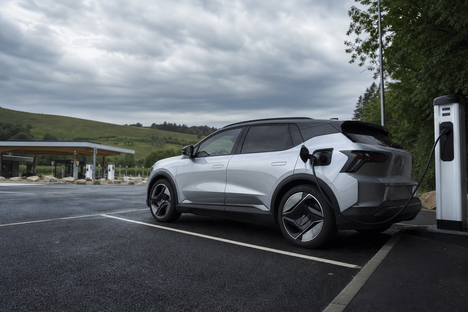 Electric SUV charging at a UK motorway service station